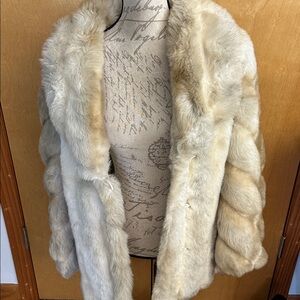 Coat saids fur on jacket not sure what kind beautiful no flaws so soft